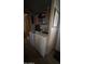 Functional laundry room with washer, dryer, storage shelves, and wood-look floors at 11596 W Sierra Dawn Blvd # 64, Surprise, AZ 85374
