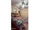 Comfortable bedroom featuring a bed with colorful patterned quilt and ample closet space at 11596 W Sierra Dawn Blvd # 64, Surprise, AZ 85374
