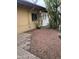 Backyard area featuring desert landscaping, block pathway, and mature cactus at 12639 N 113Th Dr, Youngtown, AZ 85363