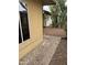 Backyard view featuring desert landscaping, block pathway, and chain link fence at 12639 N 113Th Dr, Youngtown, AZ 85363