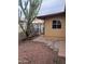 Backyard view showing desert landscaping, block pathway, and mature cactus at 12639 N 113Th Dr, Youngtown, AZ 85363