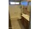 A bright bathroom with a tub/shower, sink with vanity, and linoleum flooring at 12639 N 113Th Dr, Youngtown, AZ 85363
