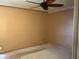A neutral bedroom with a ceiling fan and neutral carpet at 12639 N 113Th Dr, Youngtown, AZ 85363
