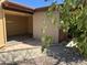 Exterior shot of the property featuring a covered parking area and desert landscaping for low maintenance at 12639 N 113Th Dr, Youngtown, AZ 85363