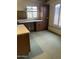 A functional room with a desk and cabinet storage at 12639 N 113Th Dr, Youngtown, AZ 85363