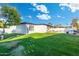 Spacious backyard with lush green lawn, trees and privacy fencing at 1317 E Verlea Dr, Tempe, AZ 85282