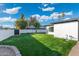 Well-maintained backyard with lush green lawn and privacy fencing at 1317 E Verlea Dr, Tempe, AZ 85282
