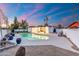 Well maintained backyard with a pool, patio, grass and privacy fencing at 1317 E Verlea Dr, Tempe, AZ 85282