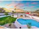Inviting backyard pool and lush landscaping offers a serene outdoor living space at 1317 E Verlea Dr, Tempe, AZ 85282