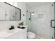 Bright bathroom features a white vanity and a marble tiled walk-in shower with glass door at 1317 E Verlea Dr, Tempe, AZ 85282