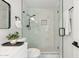 Bright bathroom features a white vanity and a marble tiled walk-in shower with glass door at 1317 E Verlea Dr, Tempe, AZ 85282