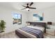 Relaxing bedroom with a large window view, neutral colored walls, and comfortable contemporary furniture at 1317 E Verlea Dr, Tempe, AZ 85282