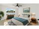 Bright bedroom with modern ceiling fan, neutral paint, and large window overlooking backyard at 1317 E Verlea Dr, Tempe, AZ 85282