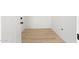 View of a home's entryway with clean, neutral walls and modern wood-look flooring throughout at 1317 E Verlea Dr, Tempe, AZ 85282
