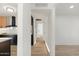 Hallway with recessed lighting leads from the kitchen to the bedrooms at 1317 E Verlea Dr, Tempe, AZ 85282