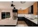 Modern kitchen showcasing two-toned cabinets, central island, and stainless appliances with natural light at 1317 E Verlea Dr, Tempe, AZ 85282
