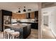 Modern kitchen showcasing two-toned cabinets, a central island with seating, and bright, open space at 1317 E Verlea Dr, Tempe, AZ 85282