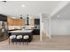 The open-concept kitchen features stylish fixtures, an island with bar stool seating, and stainless appliances at 1317 E Verlea Dr, Tempe, AZ 85282