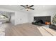 The living area features fan, recessed lights, a modern fireplace, and bright neutral paint at 1317 E Verlea Dr, Tempe, AZ 85282