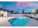 Backyard pool featuring a patio, fence, potted plants and colorful sunset sky at 1317 E Verlea Dr, Tempe, AZ 85282