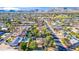 Expansive aerial view of a suburban neighborhood with swimming pools and mountain views in the distance at 14821 N Hana Maui Dr, Phoenix, AZ 85022