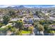 An aerial perspective of homes, showcasing manicured lawns and a serene, tree-filled environment at 14821 N Hana Maui Dr, Phoenix, AZ 85022