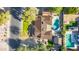 Aerial view of the house showing its roof, lawn, pool, RV Parking, landscaping, and the surrounding neighborhood at 14821 N Hana Maui Dr, Phoenix, AZ 85022