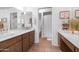 Bright bathroom featuring double sinks with marble countertops and a well-lit vanity for optimal functionality at 14821 N Hana Maui Dr, Phoenix, AZ 85022