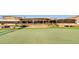 The Moon Valley clubhouse exterior with a view of a manicured green and lush landscaping at 14821 N Hana Maui Dr, Phoenix, AZ 85022