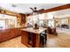 Open-concept kitchen featuring an island, wooden cabinets and beams, and seamless access to the adjacent living space at 14821 N Hana Maui Dr, Phoenix, AZ 85022