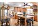 Spacious kitchen with custom wood cabinets, granite countertops, stainless steel appliances, and large center island at 14821 N Hana Maui Dr, Phoenix, AZ 85022