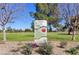 Moon Valley Park signage surrounded by greenery and trees on a bright, sunny day at 14821 N Hana Maui Dr, Phoenix, AZ 85022