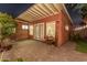 Charming backyard with brick patio, small sitting area, and well-maintained landscaping, perfect for relaxation and entertaining at 1513 W Mitchell Dr, Phoenix, AZ 85015