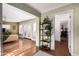 Hallway featuring open concept and doorway to the living room and doorway leading to the bedroom at 1513 W Mitchell Dr, Phoenix, AZ 85015