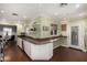 Bright kitchen with white cabinets, long counters, and modern appliances at 1513 W Mitchell Dr, Phoenix, AZ 85015