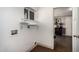 Bright laundry room with tile flooring and a view into the living room at 1513 W Mitchell Dr, Phoenix, AZ 85015