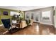 Bright living room with polished concrete floors, neutral walls and filled with plants at 1513 W Mitchell Dr, Phoenix, AZ 85015