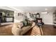 Bright living room featuring a comfortable sofa, stylish decor, and abundant natural light at 1513 W Mitchell Dr, Phoenix, AZ 85015