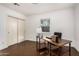Bright home office featuring modern desk, natural light from large window and storage closet at 1513 W Mitchell Dr, Phoenix, AZ 85015