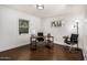 Bright office featuring modern desk, two desk chairs, and natural light from large windows at 1513 W Mitchell Dr, Phoenix, AZ 85015