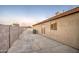 The home has a low maintenance backyard patio with an air conditioning unit and block fence at 15443 N 86Th Ln, Peoria, AZ 85382