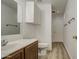 Bright bathroom with a vanity, updated sink, and wood-look flooring, creating a comfortable space at 15443 N 86Th Ln, Peoria, AZ 85382