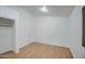 Bright bedroom with wood flooring, a door and closet, offering ample space for a comfortable retreat at 15443 N 86Th Ln, Peoria, AZ 85382