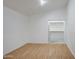 Well lit bedroom with light wood flooring and a closet offering ample space for a comfortable retreat at 15443 N 86Th Ln, Peoria, AZ 85382