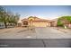 Charming single-story home with a well-maintained desert landscape and inviting curb appeal at 15443 N 86Th Ln, Peoria, AZ 85382