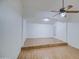 Open concept living space with wood floors and a ceiling fan creating a comfortable atmosphere at 15443 N 86Th Ln, Peoria, AZ 85382