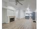 Spacious living room with a fireplace and view to the kitchen, perfect for entertaining at 15443 N 86Th Ln, Peoria, AZ 85382