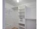 Bright walk-in closet featuring adjustable shelves and drawers for easy storage and organization at 15443 N 86Th Ln, Peoria, AZ 85382