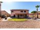 Well-kept backyard features a fountain, mature landscaping, and a covered patio perfect for enjoying the outdoors at 1737 S Talbot --, Mesa, AZ 85209