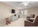 Spacious bonus room with plush carpeting, neutral walls, ceiling fan and comfortable armchairs at 1737 S Talbot --, Mesa, AZ 85209